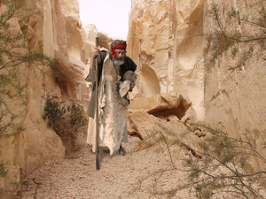 Off he went walking down the dirty road