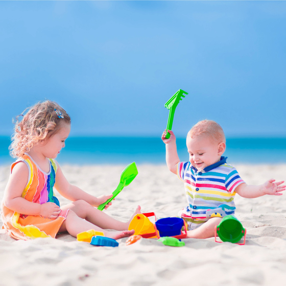 siblings at the beach